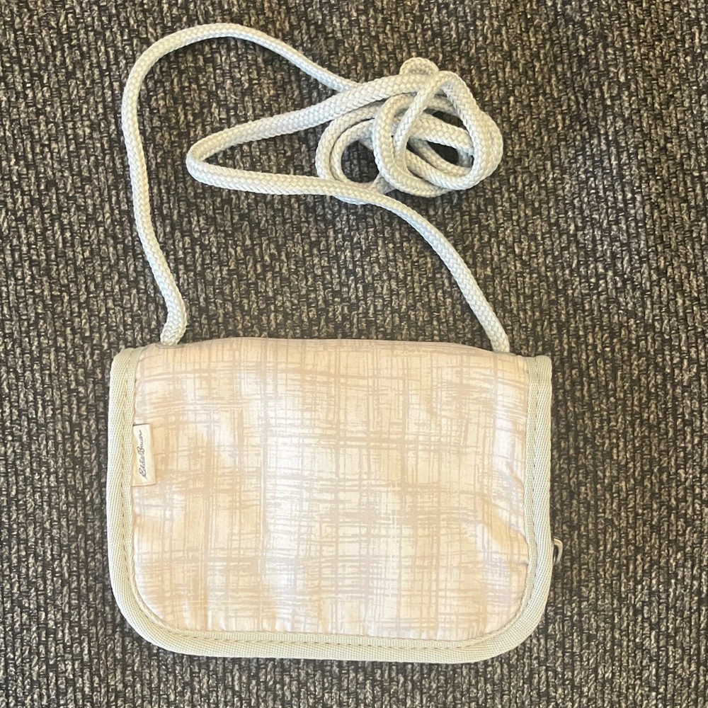 Eddie Bauer gray wallet crossbody purse with a zip-around closure.